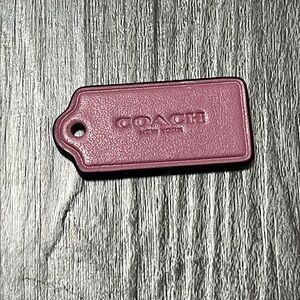 Coach purple Leather purse charm keychain.